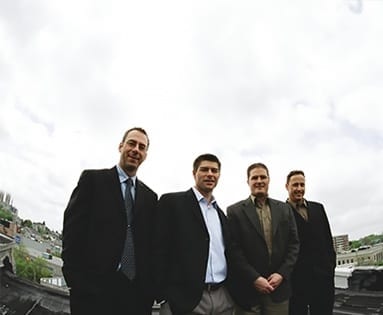 https://www.skylinegroupofcompanies.ca/wp-content/uploads/2006/07/Skyline-guys-on-roof-Web-383x315-1.jpg