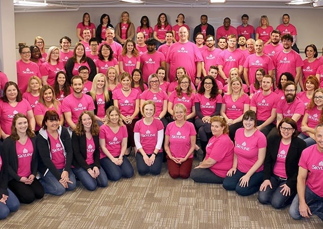 Skyline staff in pink shirts.